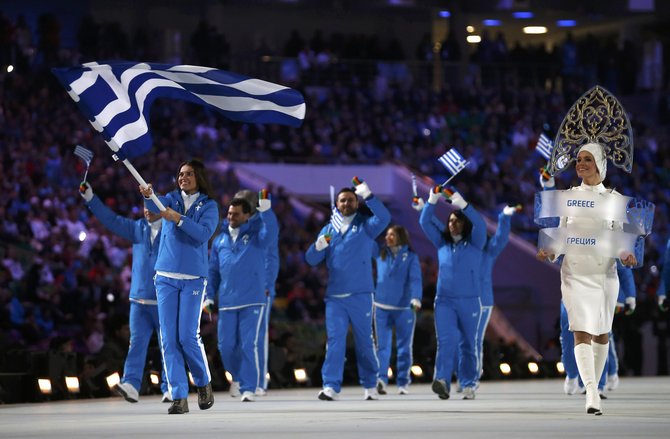 Greece's flag-bearer Panagiota Tsakiri leads her delegation as they march in during the opening ceremony of the 2014 Sochi Winter Olympics